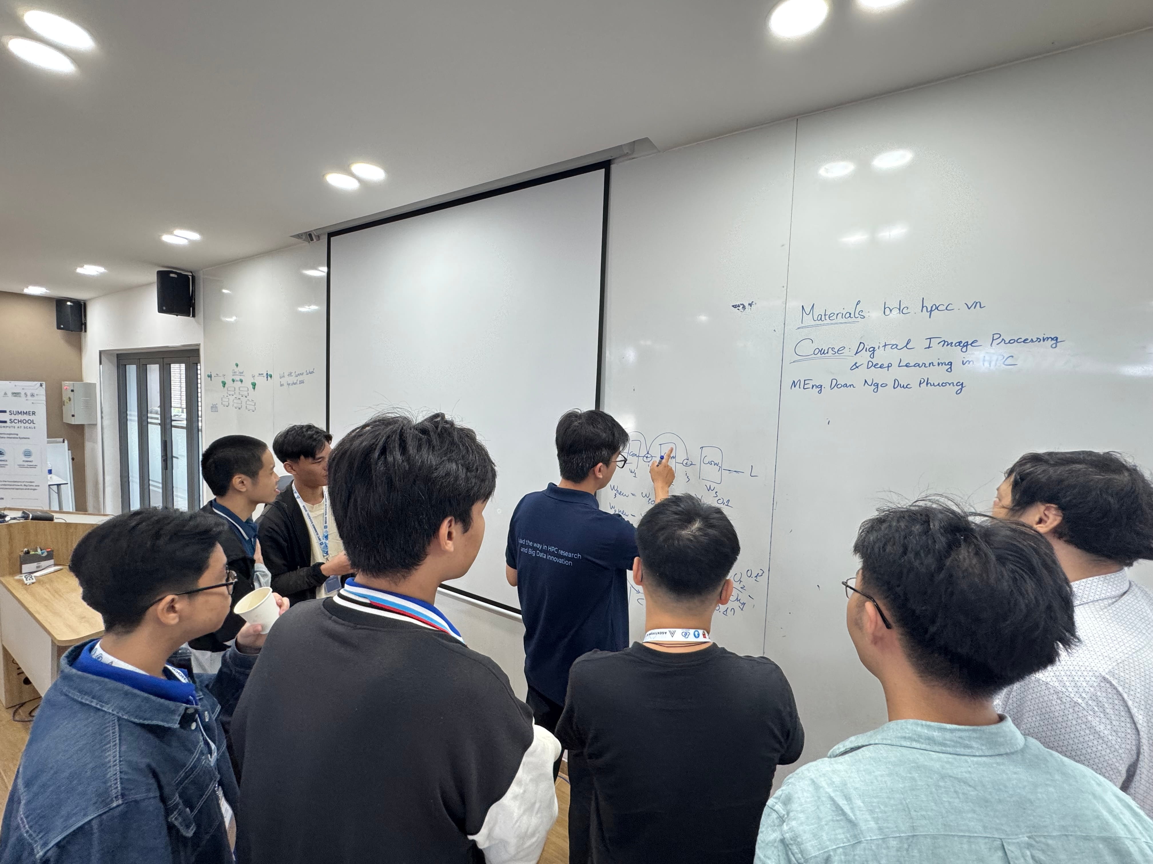 Students discussing AI topics during the summer school